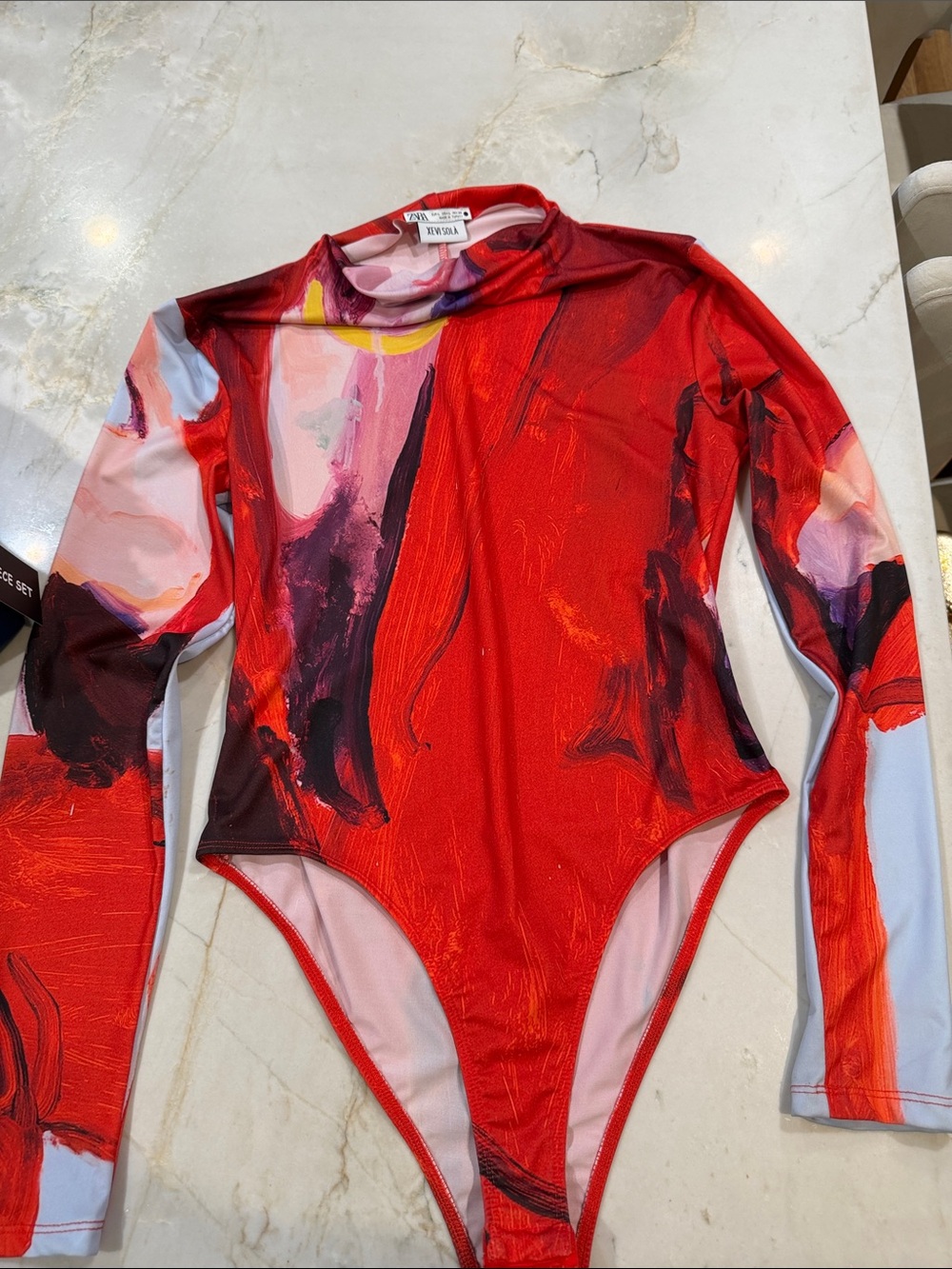 ZARA Xevi Sola Red Multicolor Abstract Long-Sleeve One-Piece Bodysuit